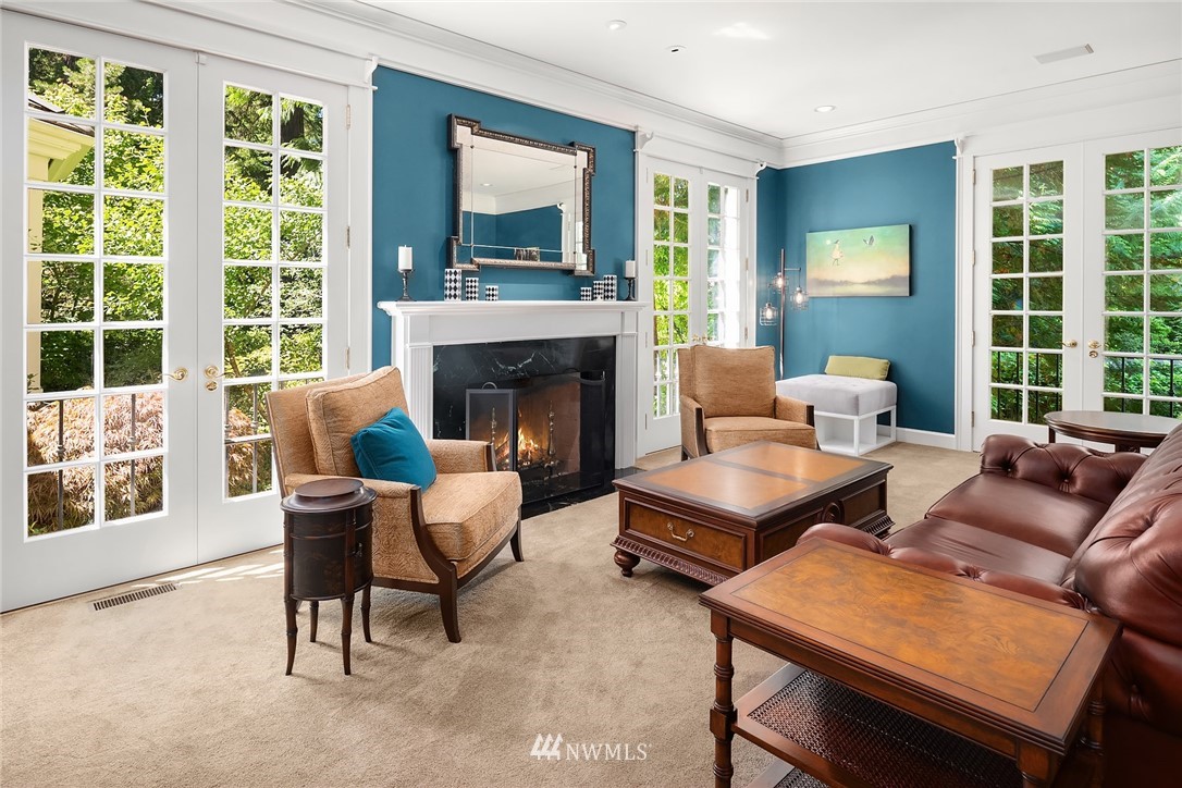 142 Moss Road Shoreline, WA 98177 - Photo 5 of 32 a living room with furniture and a fireplace