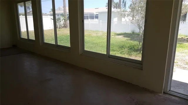 a view of a room that has a window in it