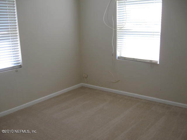 7310 Merrill Road Jacksonville, FL 32277 - Photo 4 of 4 an empty room with a window