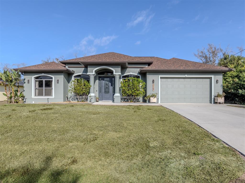 a front view of a house with garden