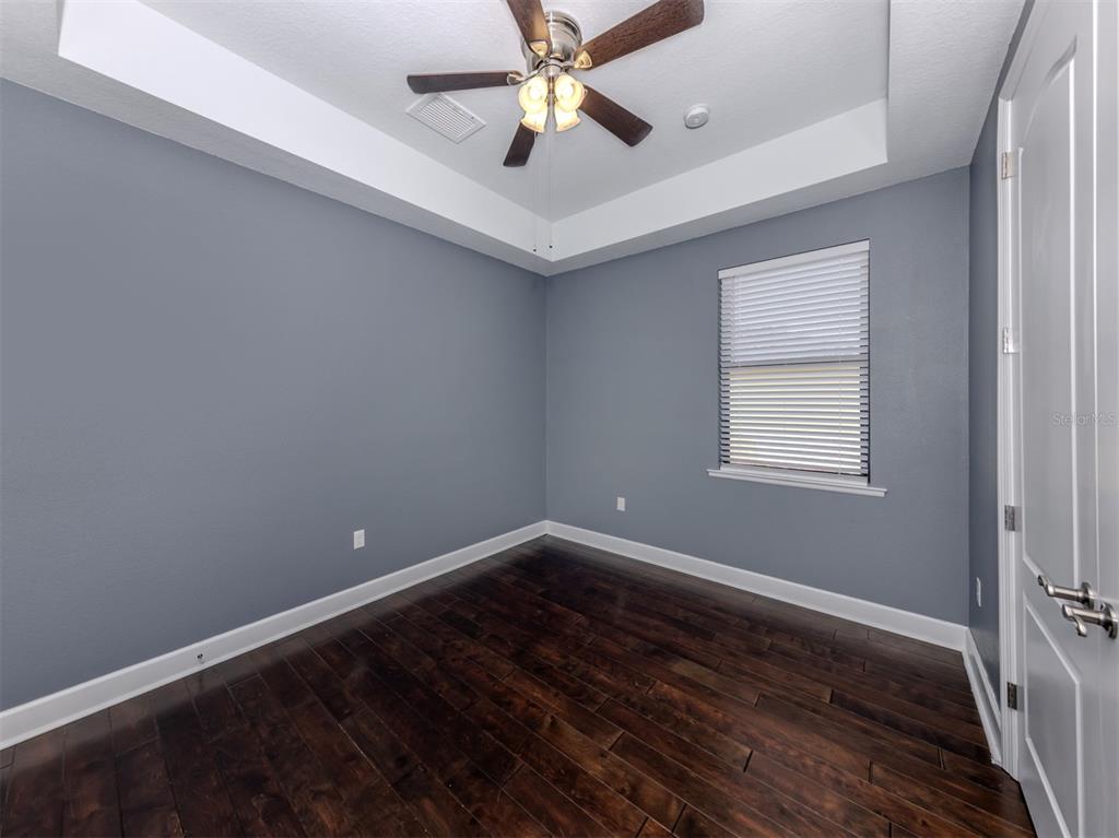 2107 Johannesberg Road North Port, FL 34288 - Photo 17 of 60 wooden floor in an empty room with a window