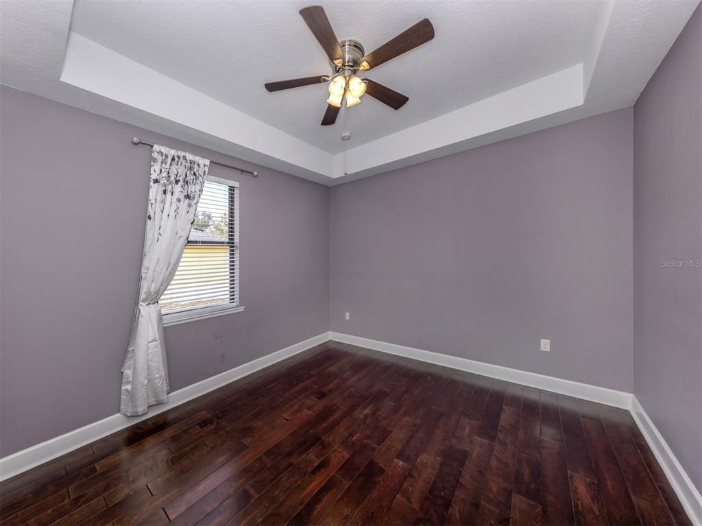 2107 Johannesberg Road North Port, FL 34288 - Photo 19 of 60 wooden floor in an empty room with a window