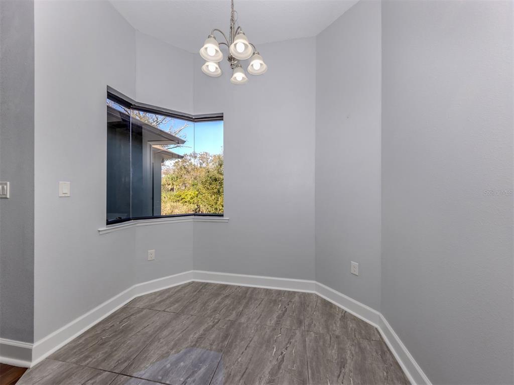 2107 Johannesberg Road North Port, FL 34288 - Photo 22 of 60 a view of room with window and wooden floor