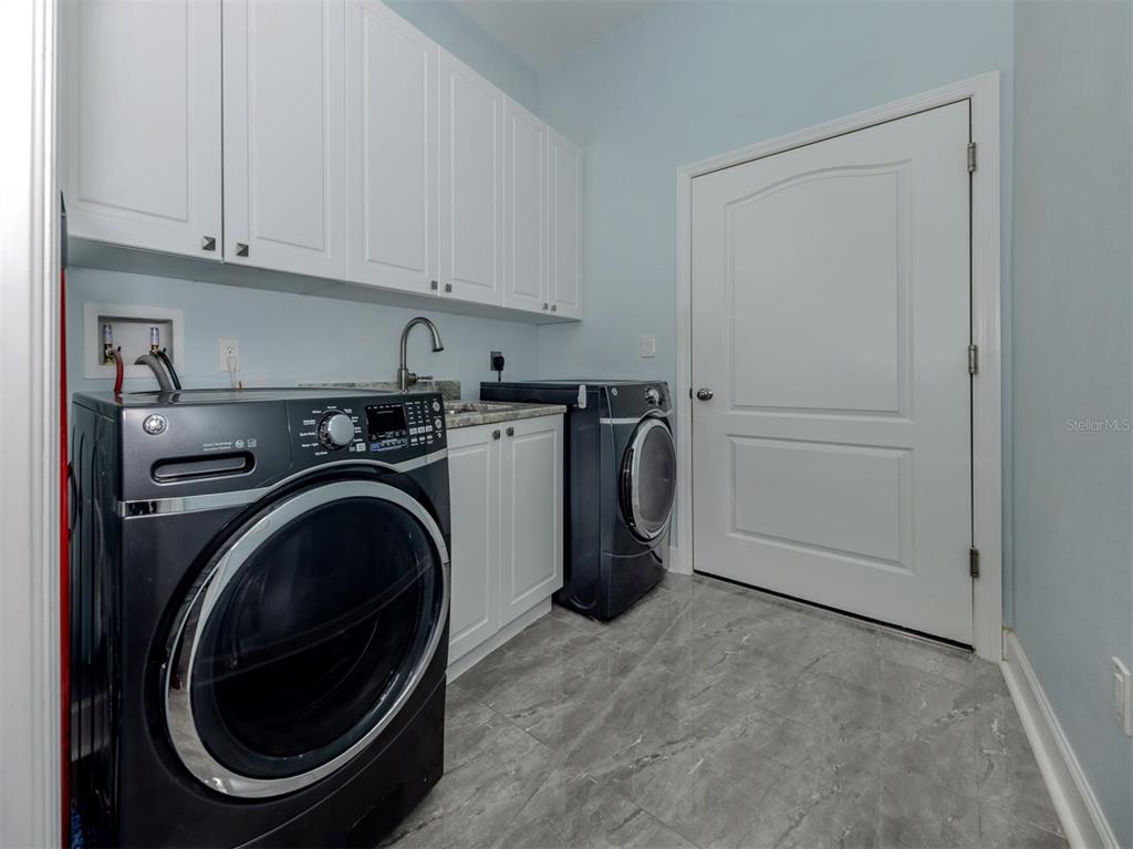2107 Johannesberg Road North Port, FL 34288 - Photo 25 of 60 a utility room with dryer and washer