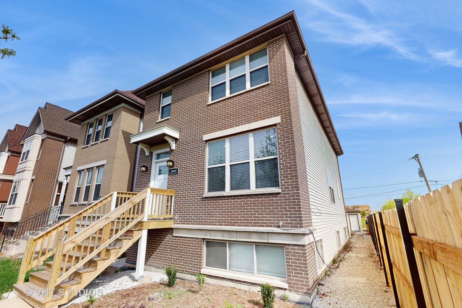 a front view of a house with many windows
