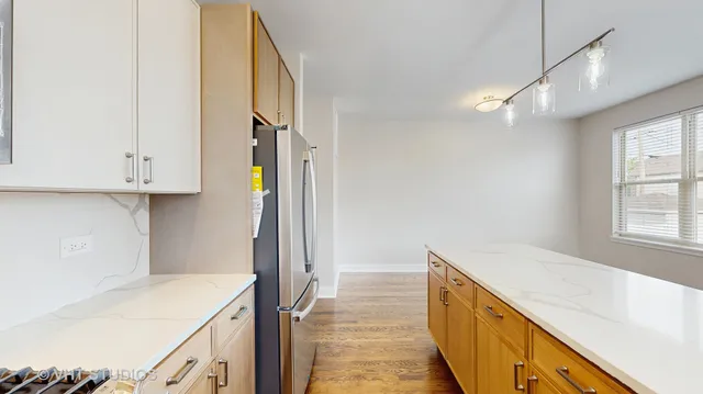 a view of a kitchen cabinets and a wooden floor