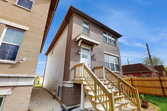a front view of a house with a street