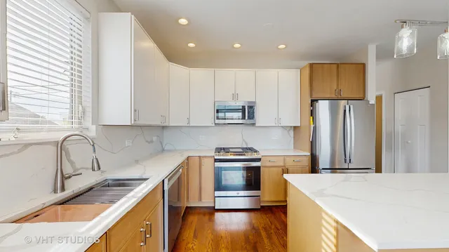 a kitchen that has a cabinets and a stove