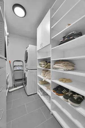 a view of storage and utility room with washer and dryer