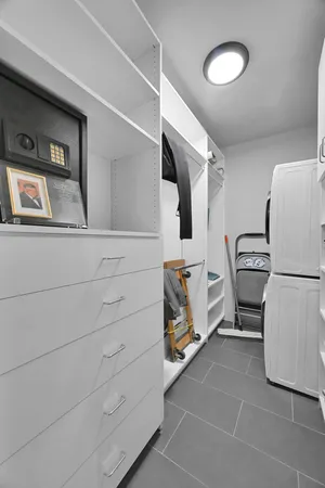 a utility room with closet dryer and washer