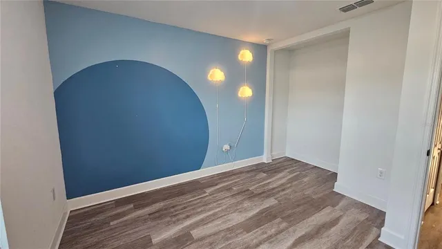 a view of a livingroom with wooden floor