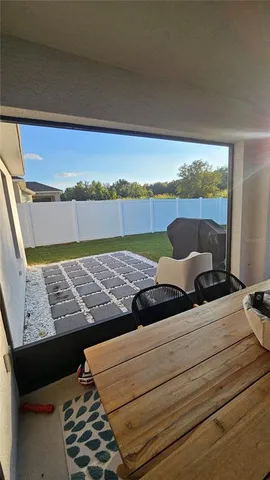 a view of a balcony with furniture