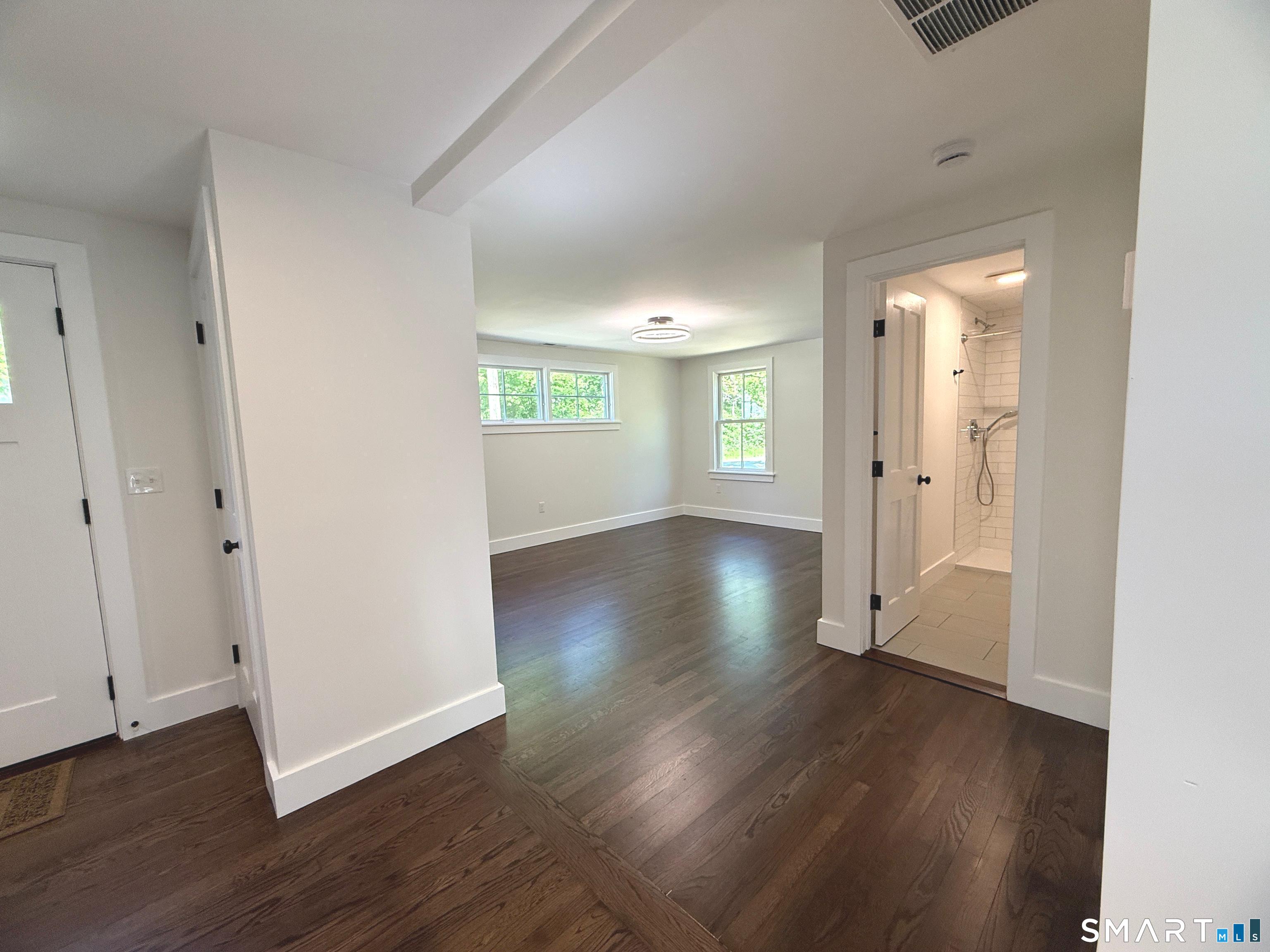 2569 Long Hill Road, Unit 2 Guilford, CT 06437 - Photo 9 of 26 view from kitchen to living room and bathroom