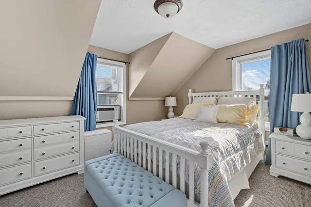 a bedroom with a bed and cabinets