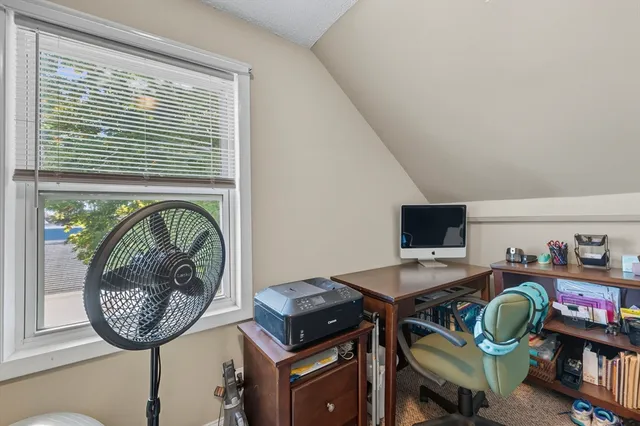 a view of a workspace with furniture
