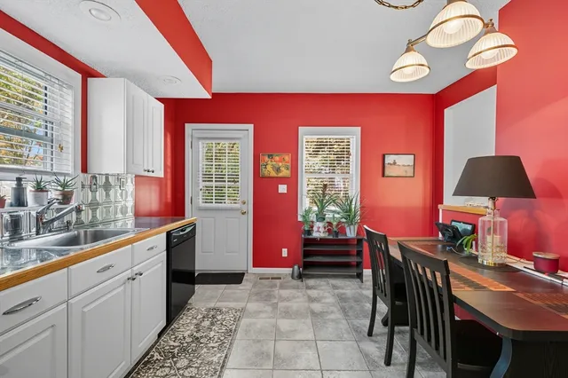 a kitchen with furniture and window