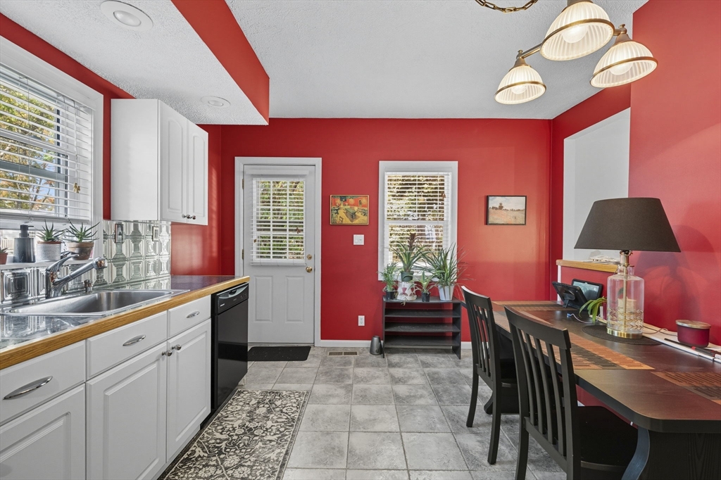 28 R School Street Danvers, MA 01923 - Photo 20 of 31 a kitchen with furniture and window