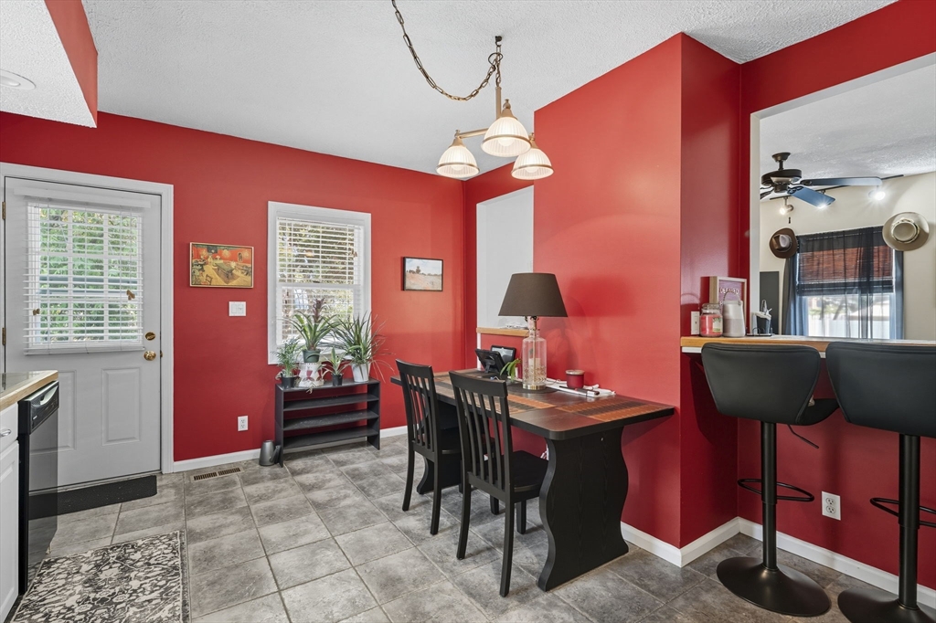 28 R School Street Danvers, MA 01923 - Photo 21 of 31 a dining room with furniture and chandelier