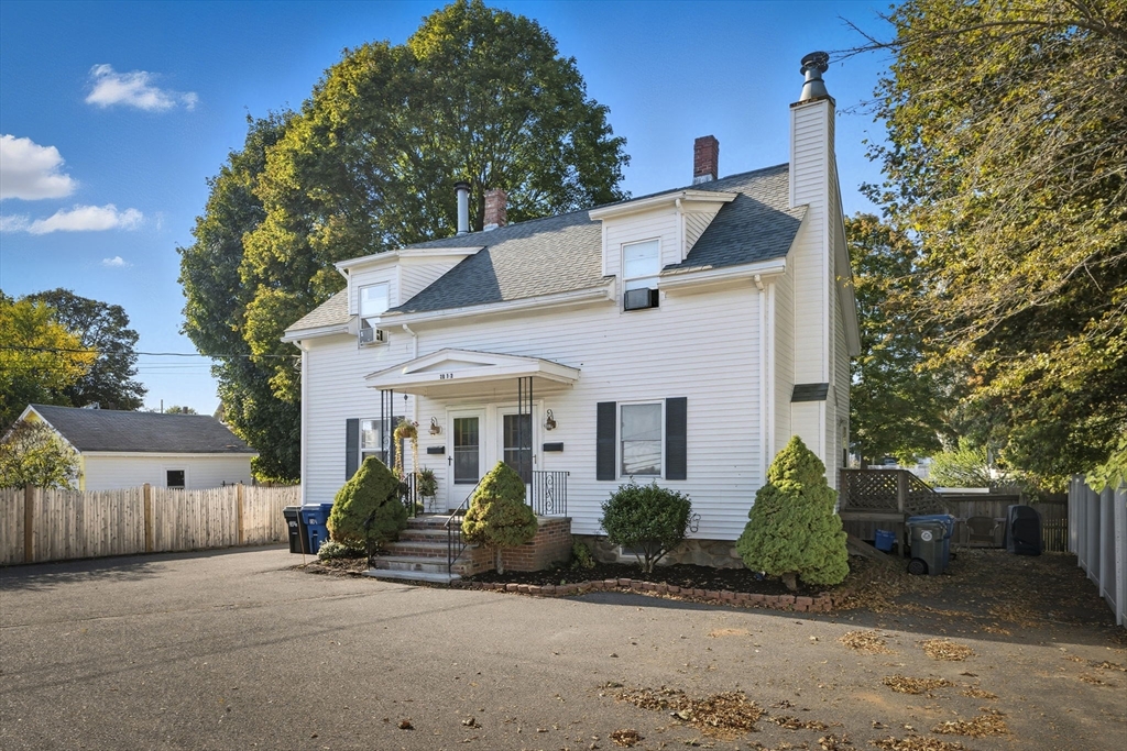 28 R School Street Danvers, MA 01923 - Photo 29 of 31 a front view of a house with a yard