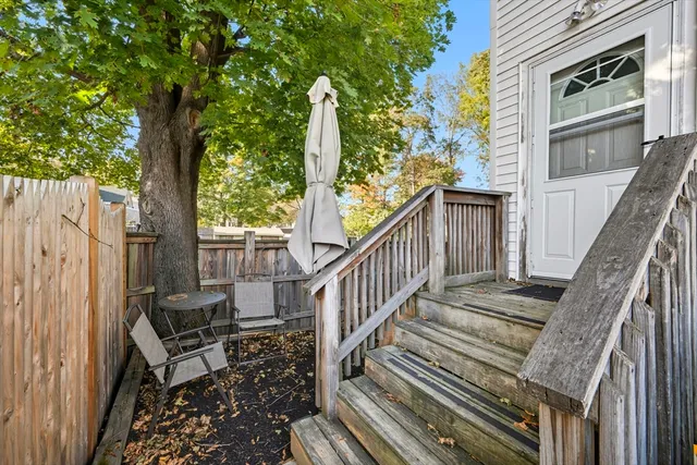a view of a house with backyard and deck