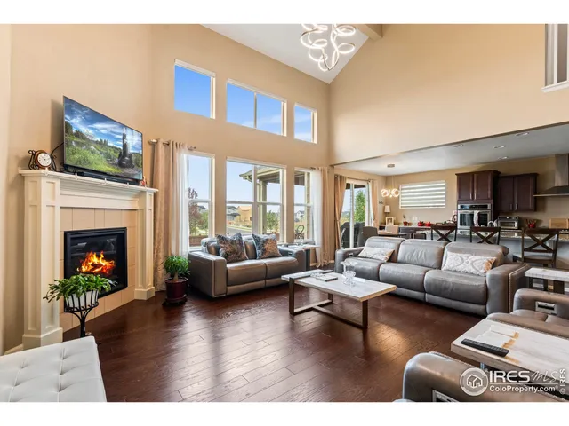 a living room with furniture or kitchen view and a wooden floor