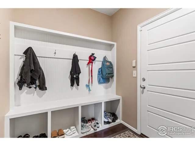 a view of hallway with wooden floor