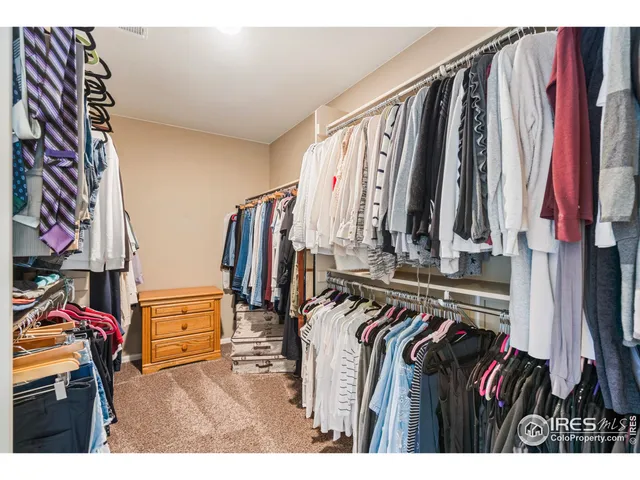 a kitchen with a refrigerator and a stove