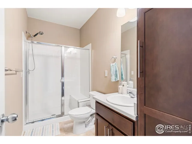 a living room with a bed and a window