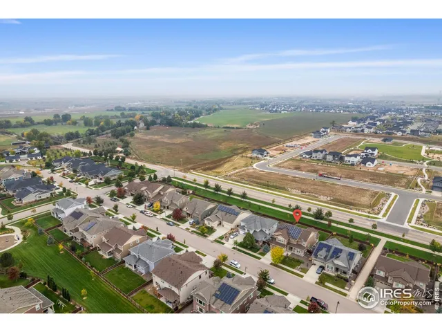 an aerial view of residential building and lake