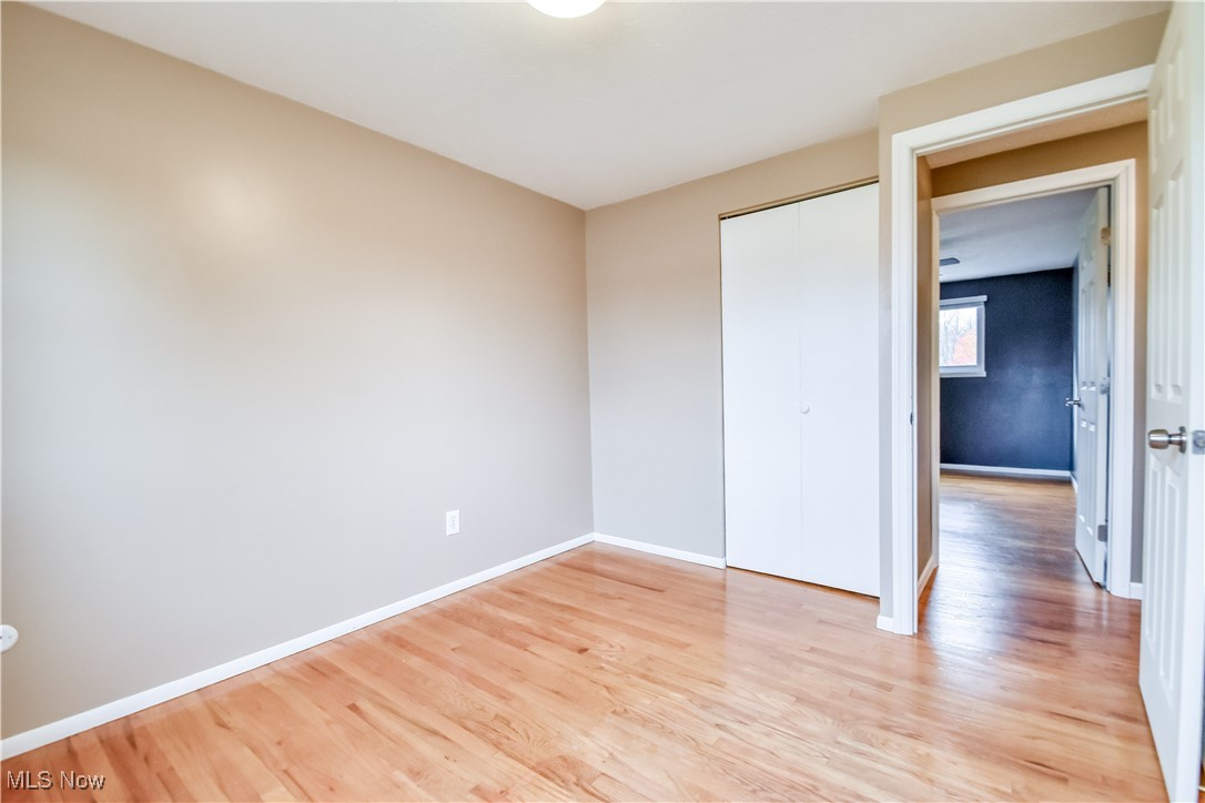 5618 Dolphin Road Mentor, OH 44060 - Photo 27 of 46 Unfurnished bedroom featuring light wood-style flooring and a closet