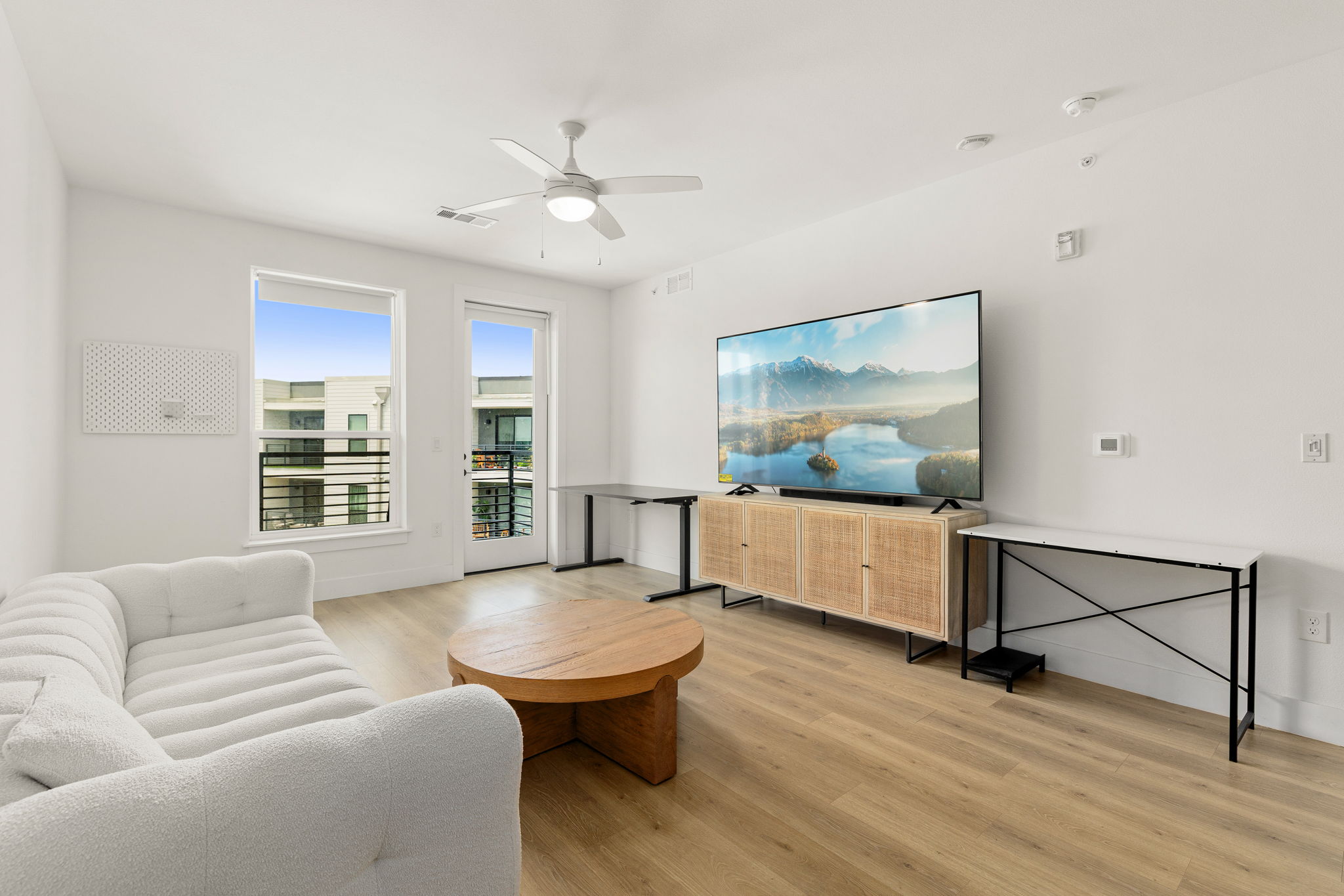 1701 Simond Avenue, Unit 612 Austin, TX 78723 - Photo 7 of 40 a living room with furniture and a flat screen tv