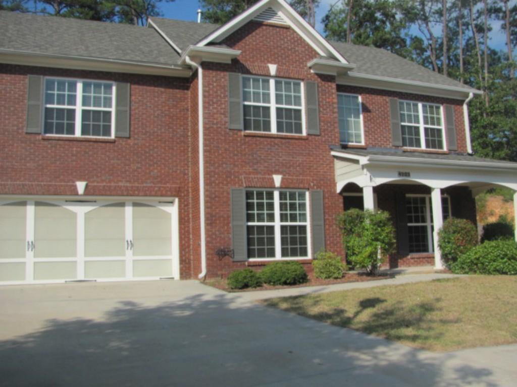 4203 Pond Edge Road Southwest, Unit 65 Snellville, GA 30039 - Photo 1 of 1 front view of a brick house with a yard
