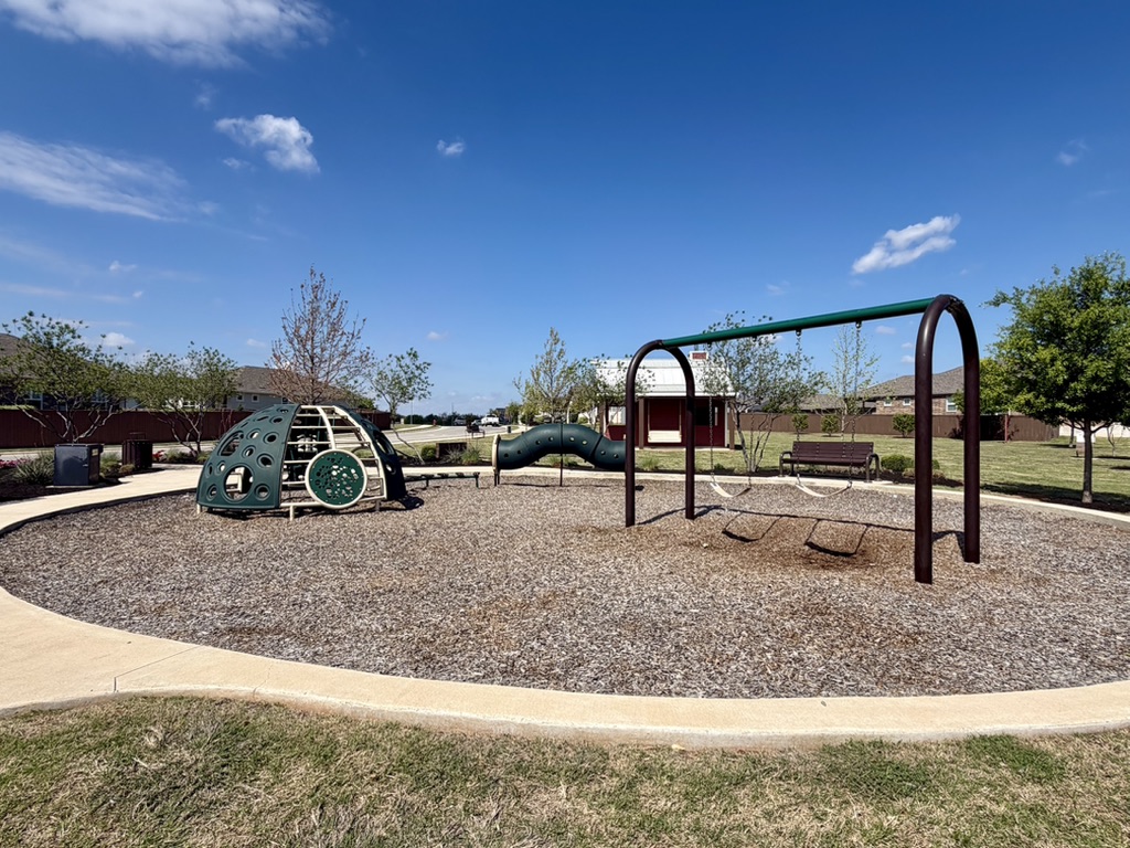 125 Slenderleaf Drive Marble Falls, TX 78654 - Photo 4 of 30 This small playground is just across the street from the home!