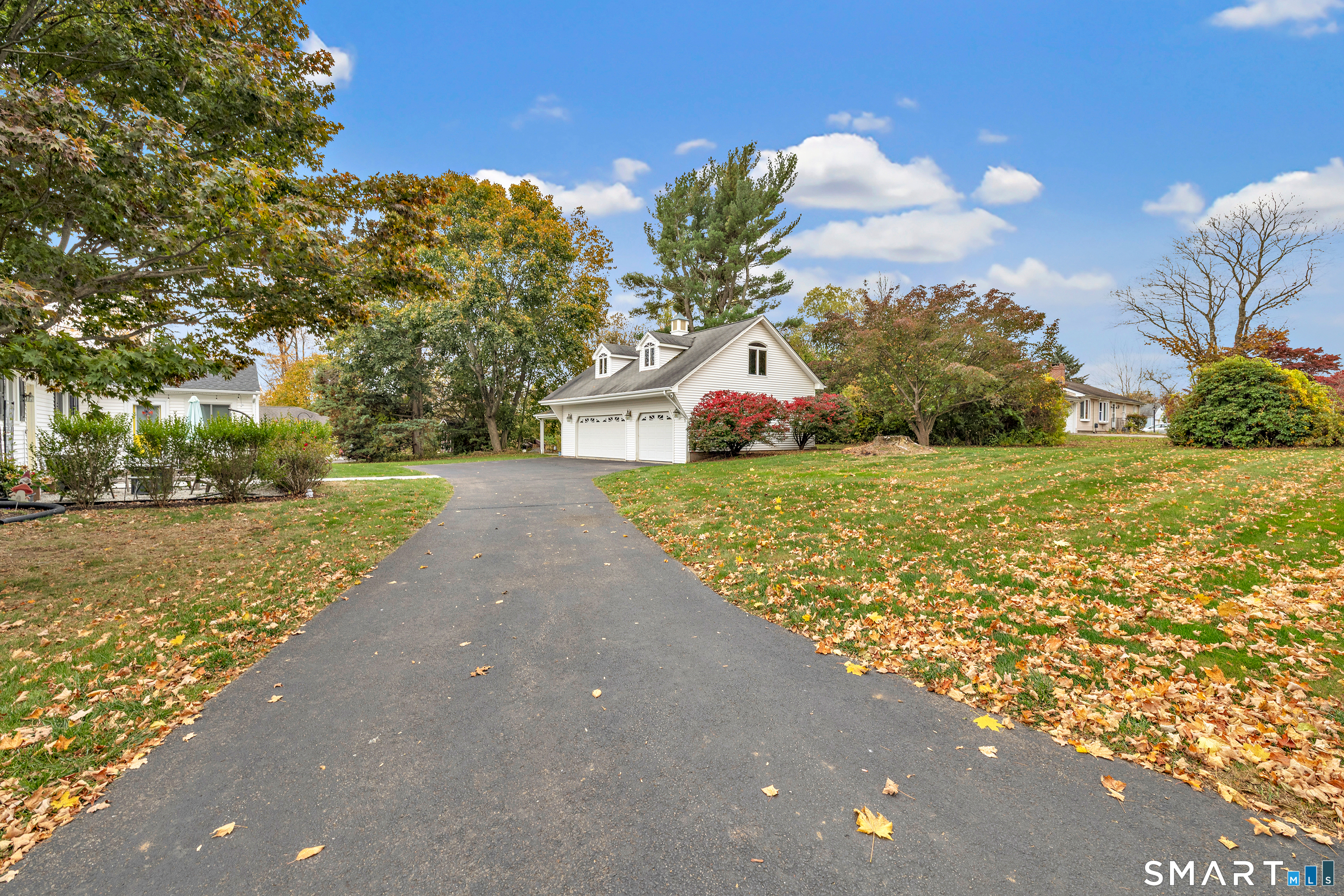 144 Ripton Road Shelton, CT 06484 - Photo 36 of 40 a view of a street with a building and trees in the background