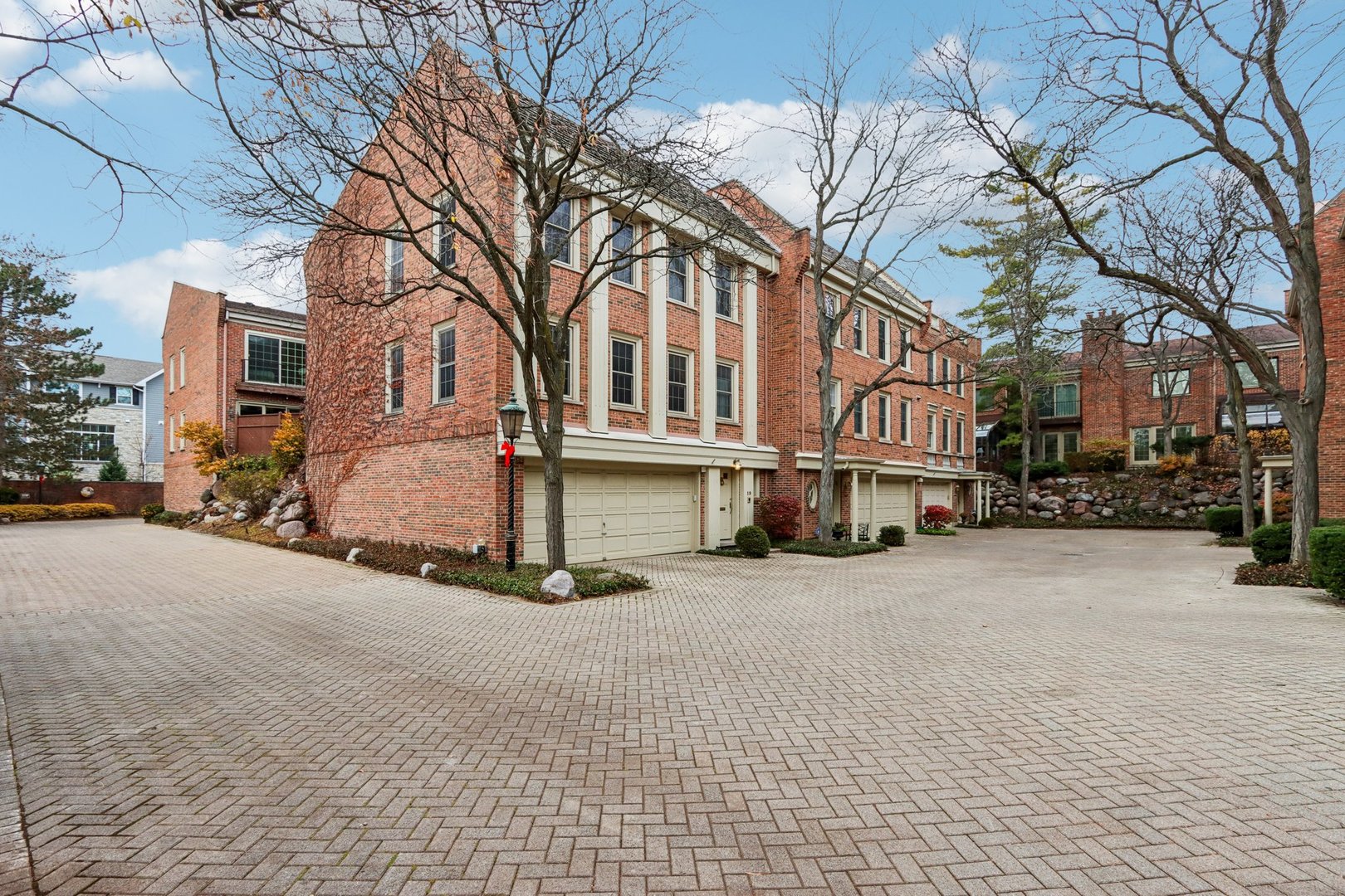 19 Landmark Street, Unit 19 Northfield, IL 60093 - Photo 1 of 50 a city street lined with buildings and trees