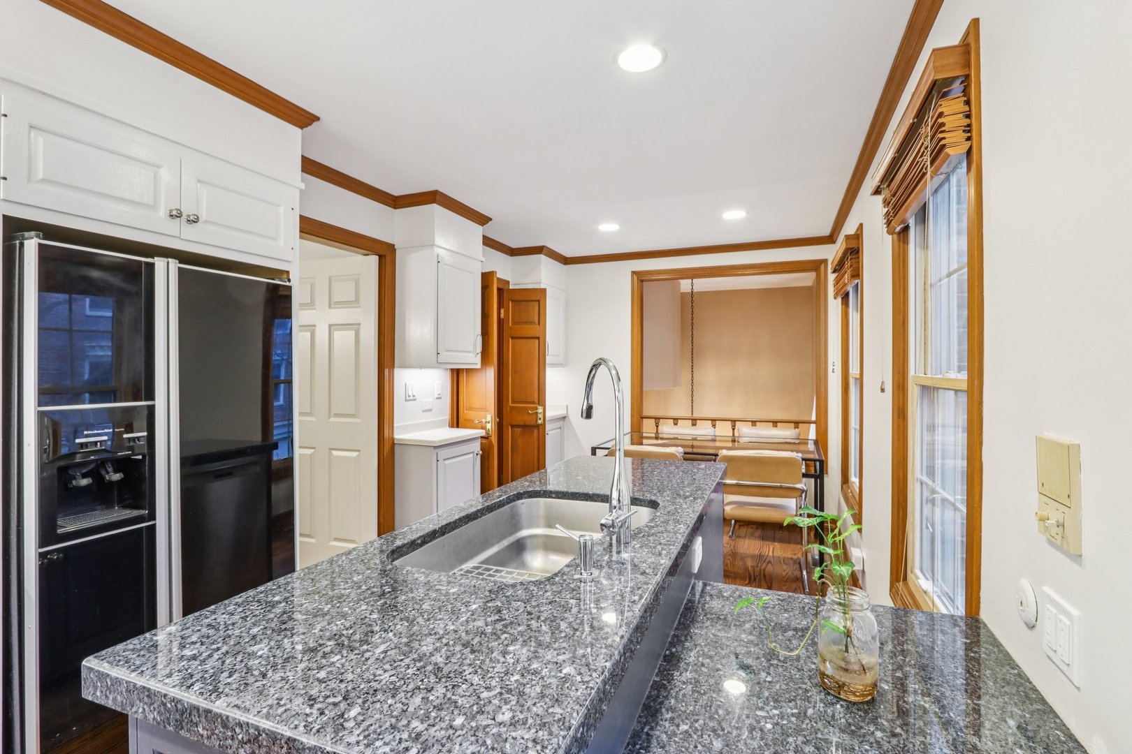 19 Landmark Street, Unit 19 Northfield, IL 60093 - Photo 14 of 50 a large white kitchen with a large window