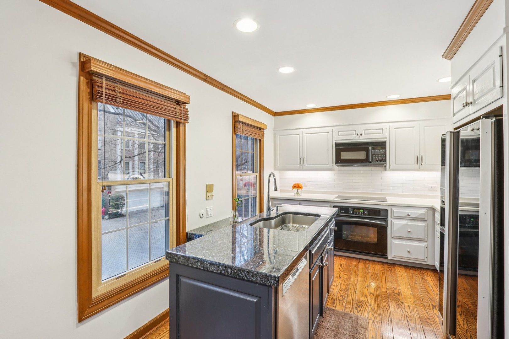 19 Landmark Street, Unit 19 Northfield, IL 60093 - Photo 16 of 50 a kitchen with stainless steel appliances granite countertop a sink and a stove