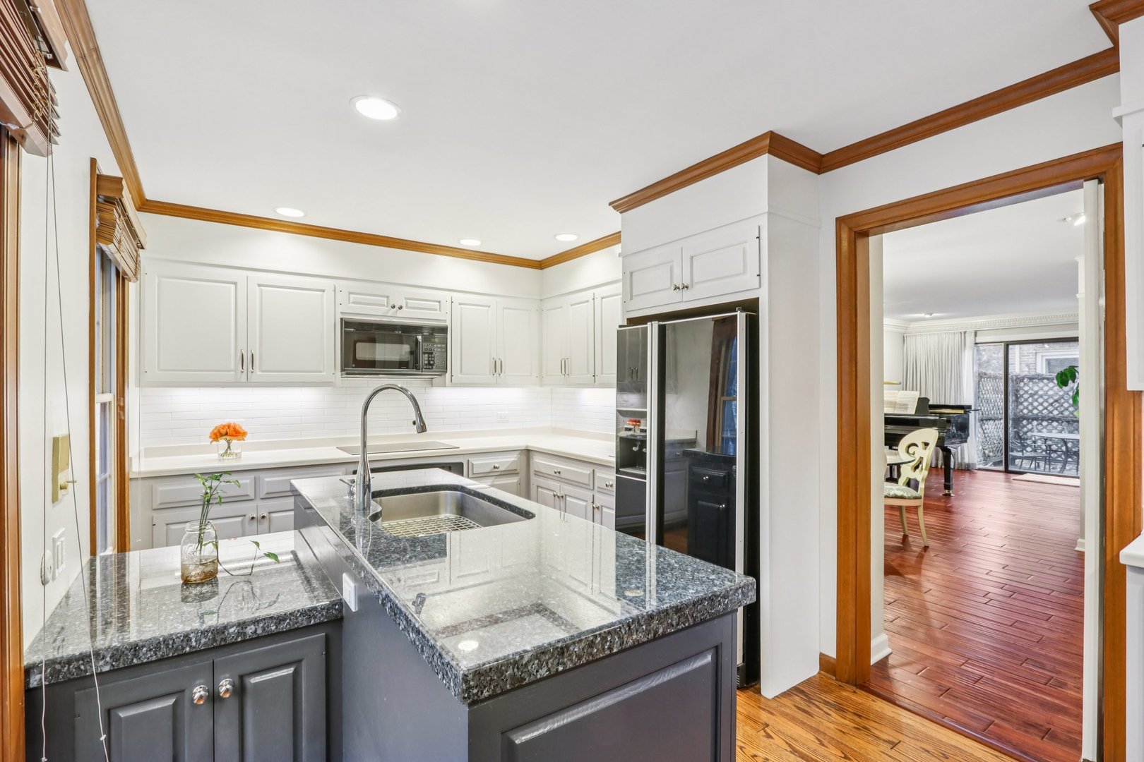 19 Landmark Street, Unit 19 Northfield, IL 60093 - Photo 17 of 50 a kitchen with granite countertop a sink stove and refrigerator