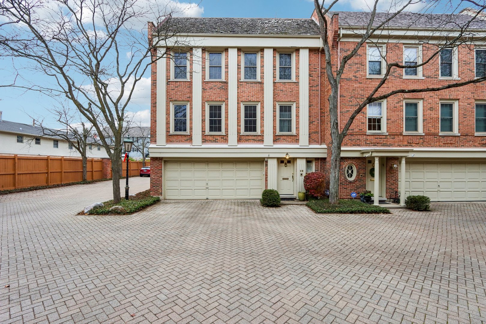 19 Landmark Street, Unit 19 Northfield, IL 60093 - Photo 2 of 50 a front view of a building with a garden
