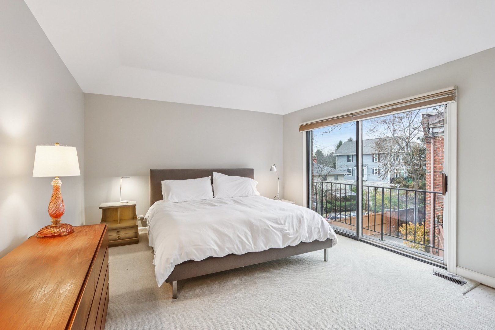 19 Landmark Street, Unit 19 Northfield, IL 60093 - Photo 22 of 50 a bedroom with a bed and lamp next to a window