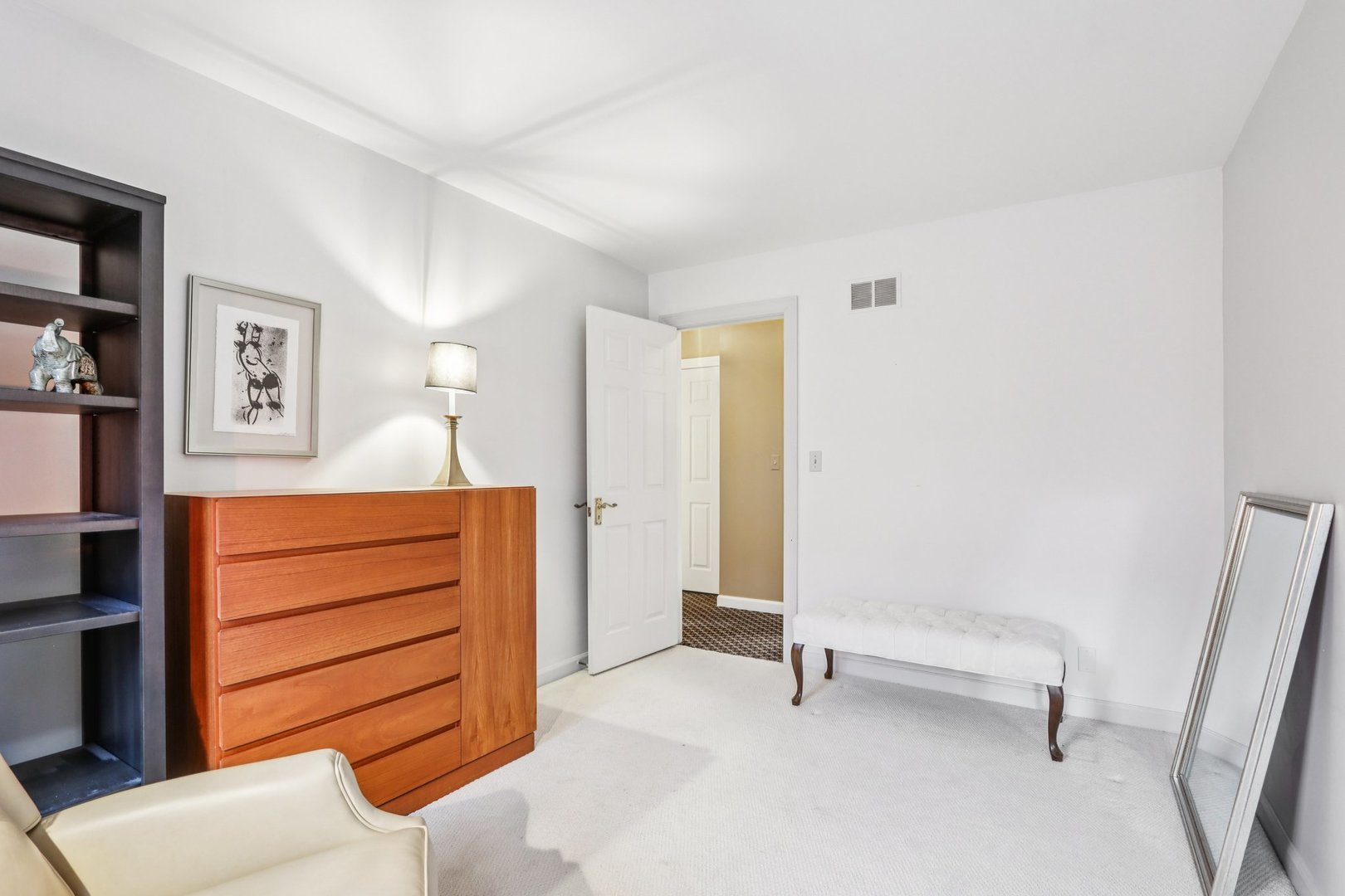 19 Landmark Street, Unit 19 Northfield, IL 60093 - Photo 31 of 50 a view of room with cabinet and air conditioner vent