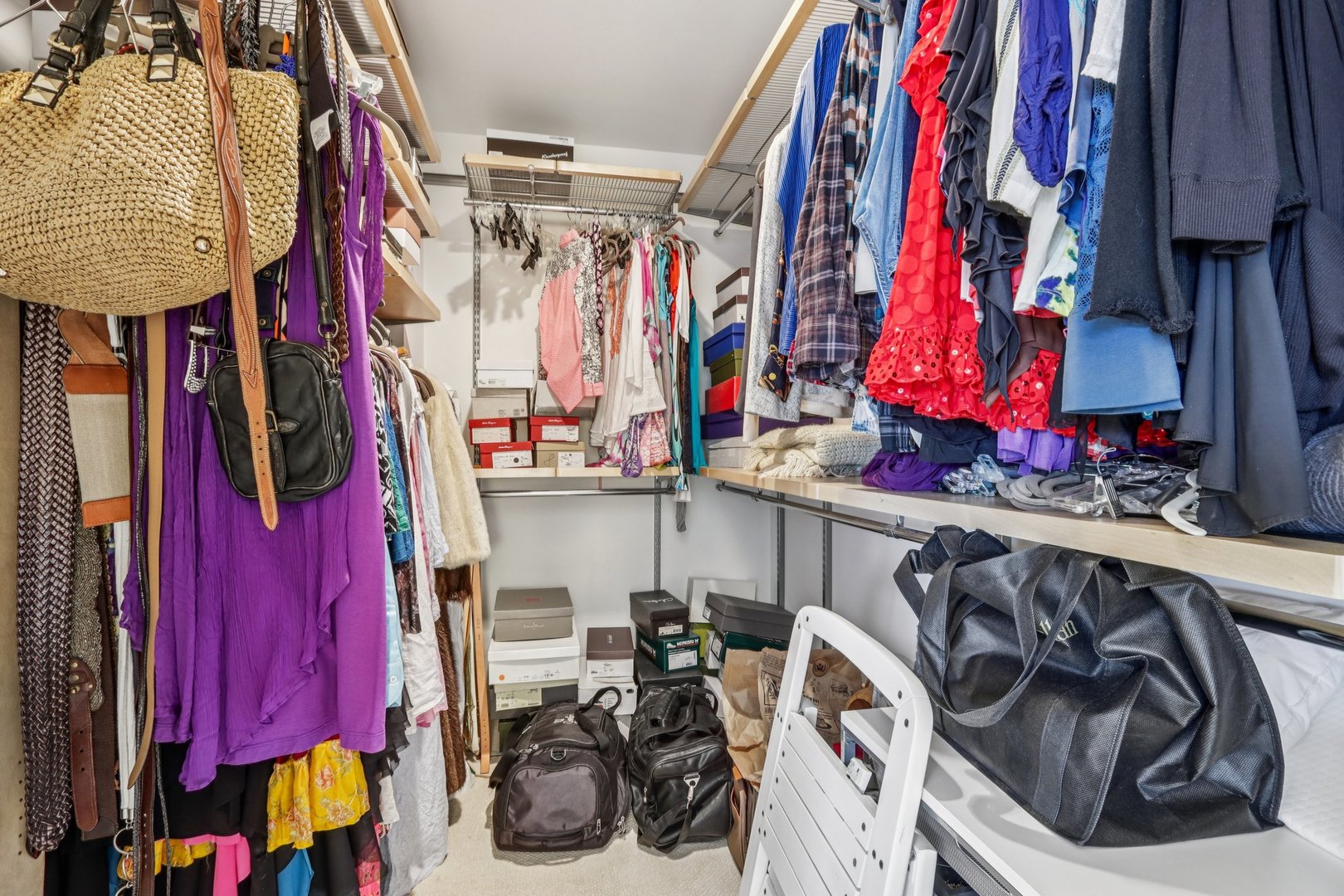 19 Landmark Street, Unit 19 Northfield, IL 60093 - Photo 32 of 50 a view of walk in closet with clothes and shoes