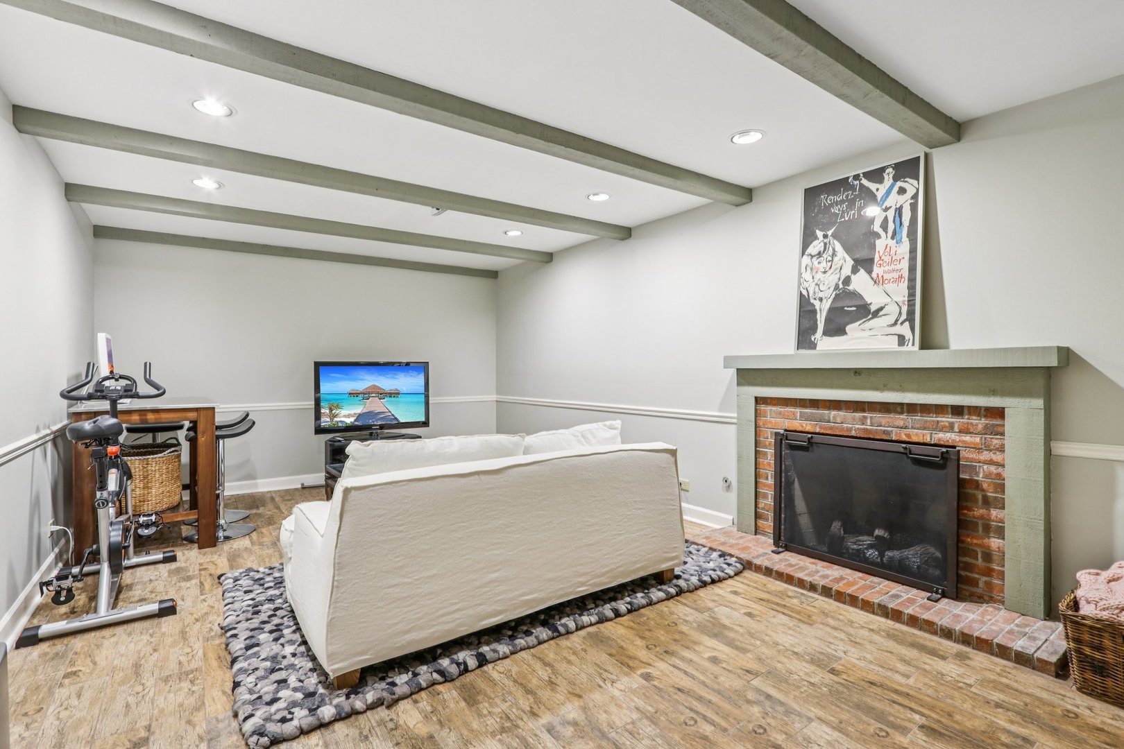 19 Landmark Street, Unit 19 Northfield, IL 60093 - Photo 37 of 50 a living room with furniture a fireplace and a flat screen tv