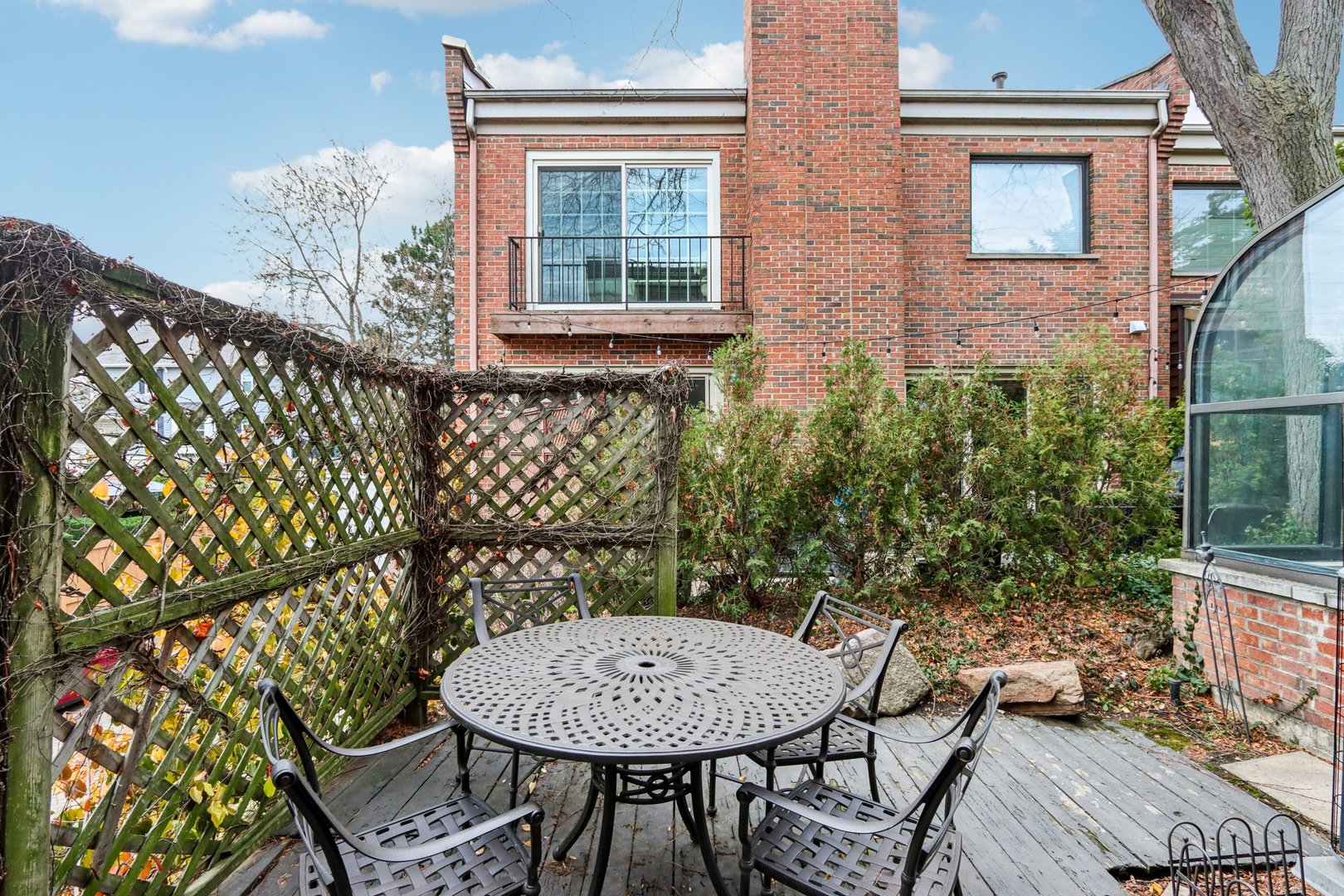 19 Landmark Street, Unit 19 Northfield, IL 60093 - Photo 41 of 50 a view of a chairs and table in the balcony