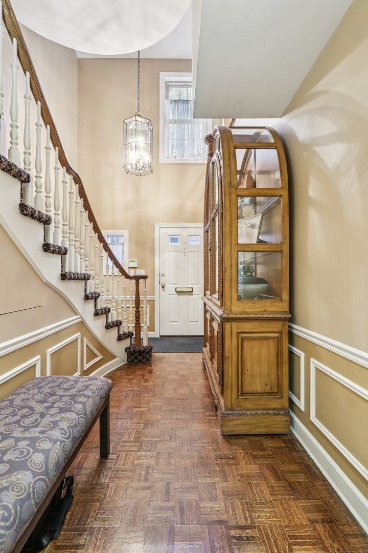 19 Landmark Street, Unit 19 Northfield, IL 60093 - Photo 6 of 50 a view of entryway and hall with wooden floor