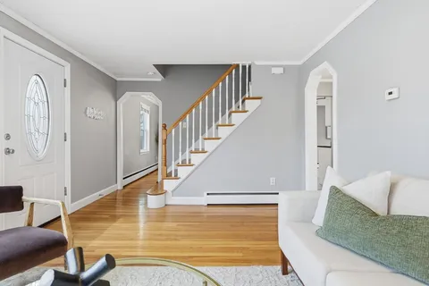 a view of livingroom with furniture and staircase