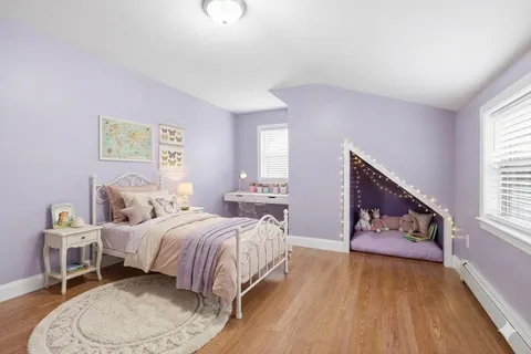 a bedroom with bed and window