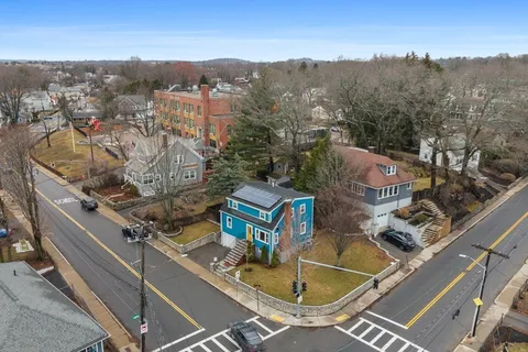 an aerial view of residential houses with outdoor space