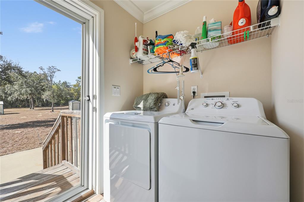 5530 Northeast 103rd Terrace Bronson, FL 32621 - Photo 21 of 29 a utility room with dryer and washer