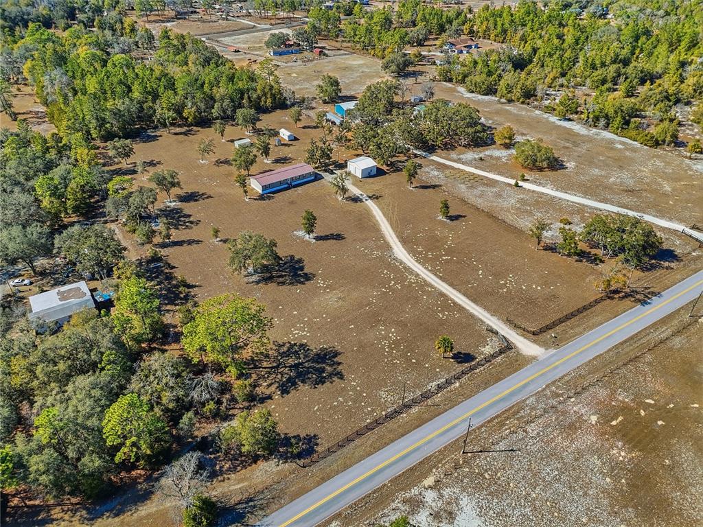 5530 Northeast 103rd Terrace Bronson, FL 32621 - Photo 27 of 29 an aerial view of residential houses with outdoor space
